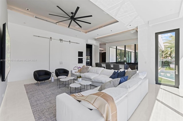 living room featuring a tray ceiling