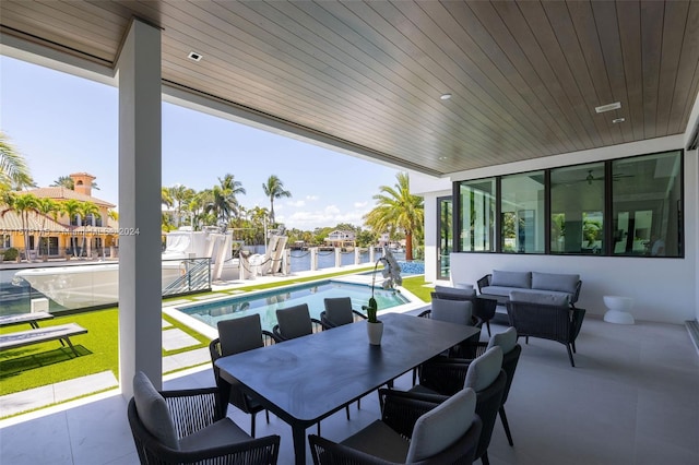 view of terrace with a fenced in pool and outdoor lounge area