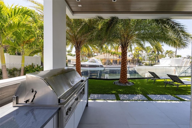 view of terrace featuring grilling area and exterior kitchen