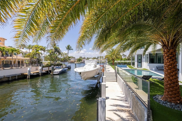 dock area featuring a fenced in pool and a water view