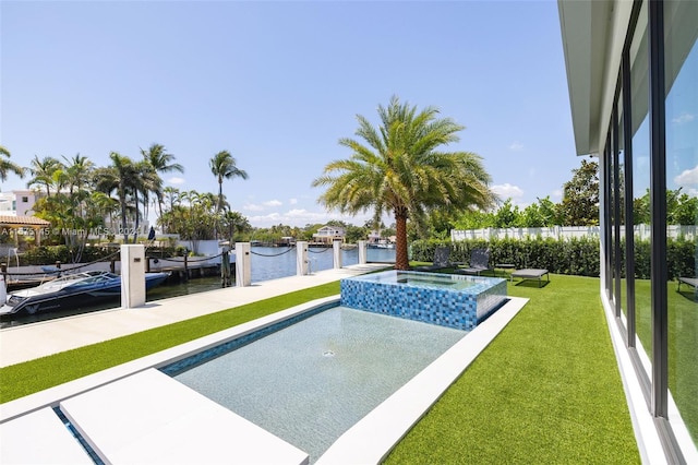 exterior space with a water view, a yard, a boat dock, and an in ground hot tub