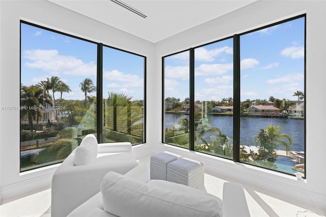 sunroom / solarium with a water view