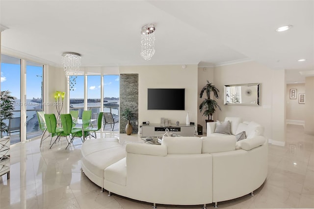 living room with an inviting chandelier, crown molding, expansive windows, and light tile flooring