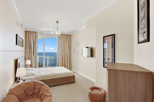 carpeted bedroom featuring a water view, crown molding, and an inviting chandelier