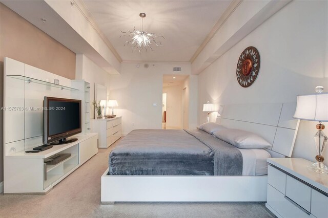 carpeted bedroom with an inviting chandelier and crown molding