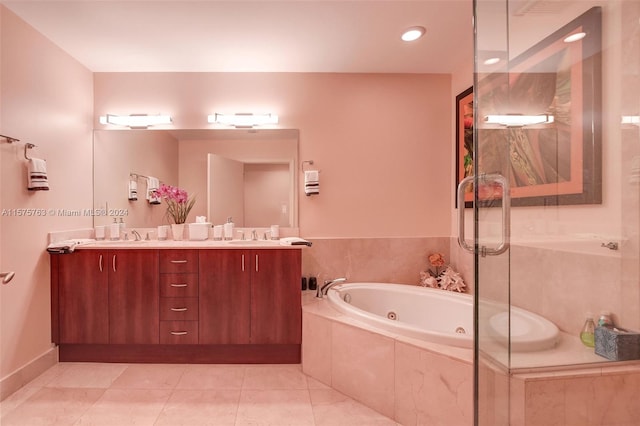 bathroom with dual bowl vanity, tile floors, and separate shower and tub