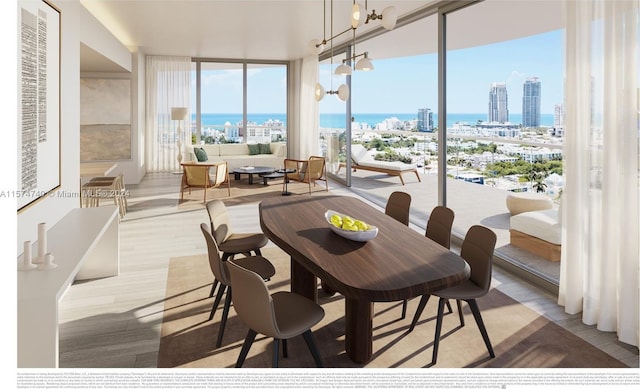 dining area with a chandelier, hardwood / wood-style flooring, expansive windows, and a water view