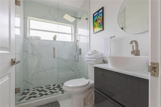 bathroom featuring walk in shower, tile patterned flooring, toilet, and vanity