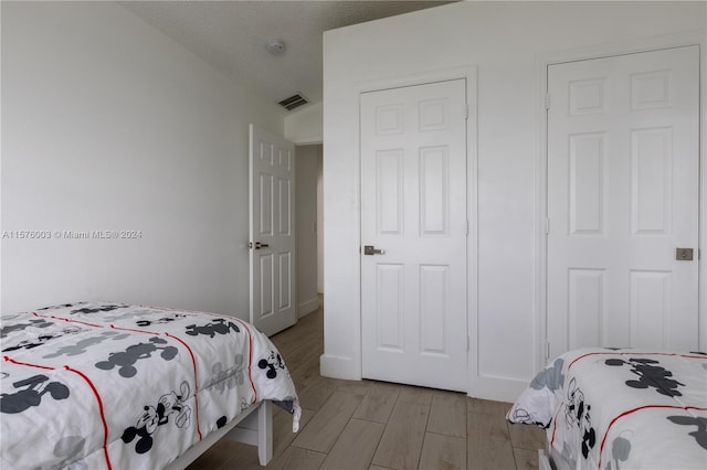 bedroom featuring light hardwood / wood-style floors