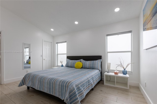 bedroom with vaulted ceiling