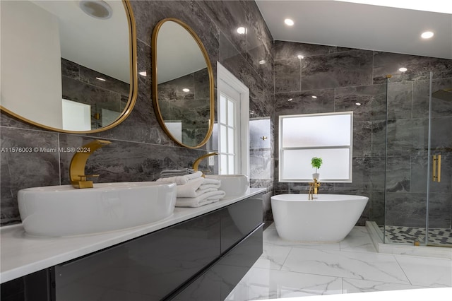 bathroom featuring vanity, shower with separate bathtub, tile patterned flooring, and tile walls