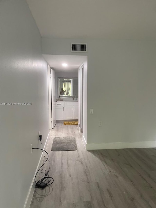 hallway featuring light hardwood / wood-style floors