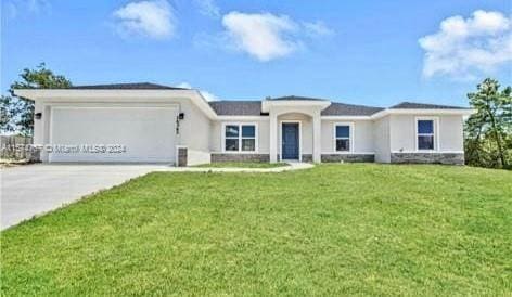 ranch-style home with a garage and a front lawn