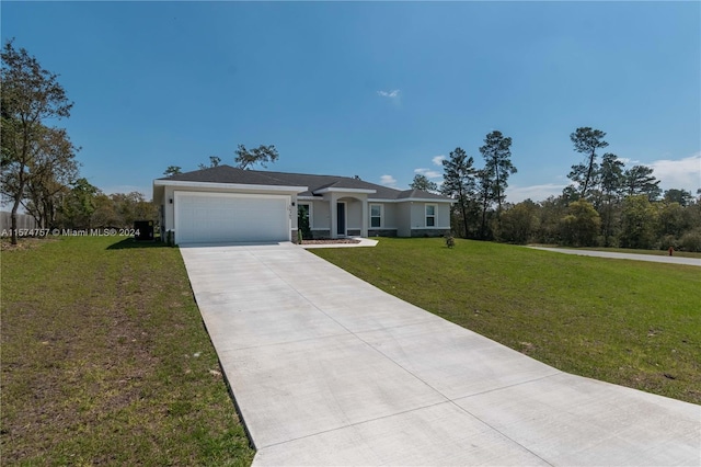 ranch-style home with a garage and a front lawn