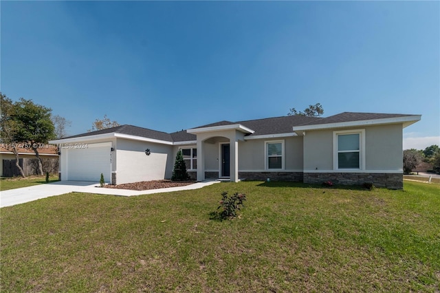 view of front of home with a garage and a front lawn