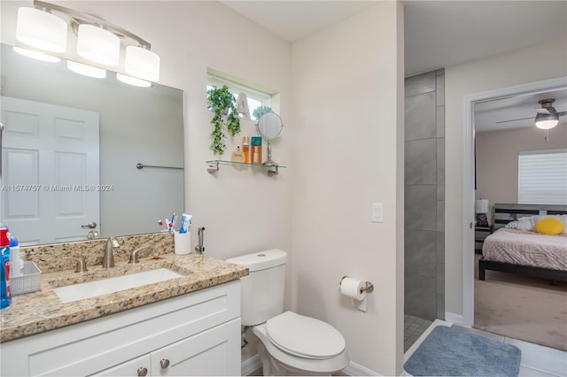 bathroom with ceiling fan, vanity, and toilet