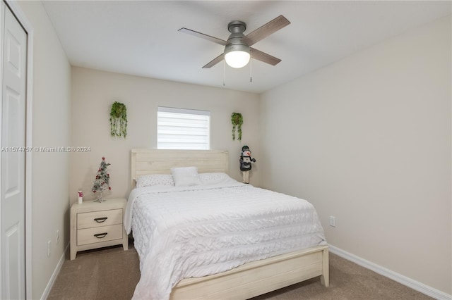 carpeted bedroom with a closet and ceiling fan