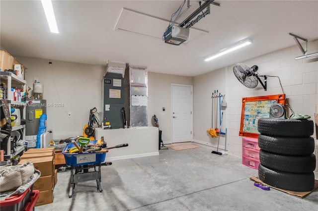 garage featuring water heater and a garage door opener