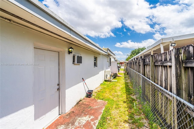 view of yard with an AC wall unit