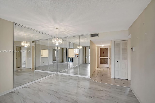 spare room featuring a textured ceiling