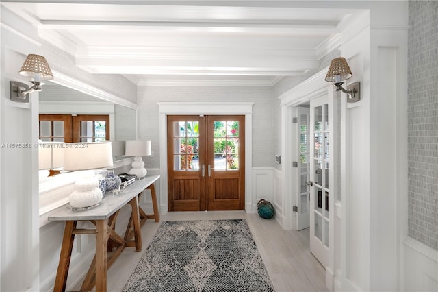 doorway with light hardwood / wood-style floors, french doors, and crown molding