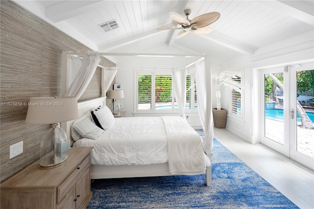 bedroom featuring hardwood / wood-style flooring, multiple windows, ceiling fan, and access to outside