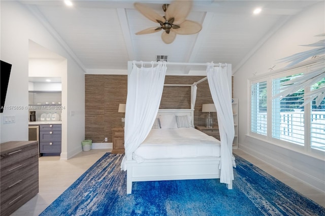 bedroom featuring lofted ceiling with beams, ceiling fan, and light wood-type flooring