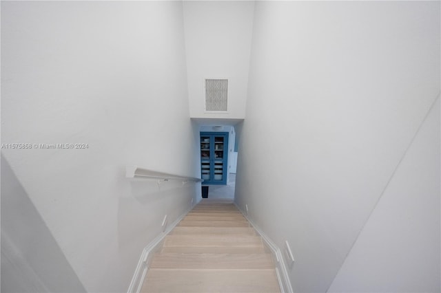 stairway featuring light wood-type flooring