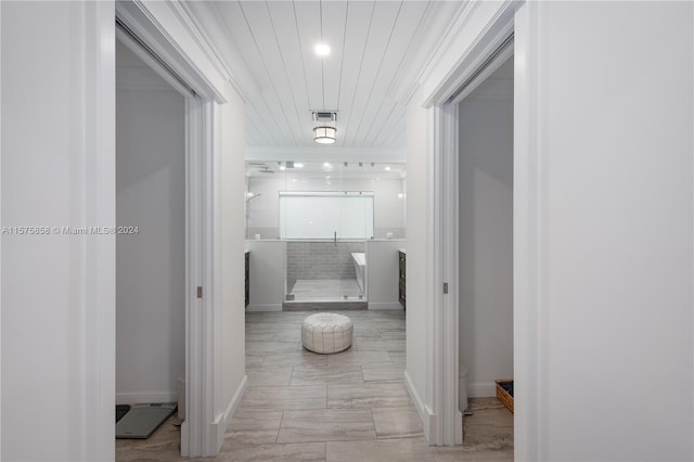 corridor with wooden ceiling and light tile flooring