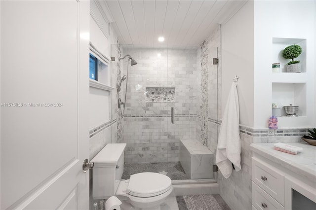 bathroom featuring tile walls, an enclosed shower, vanity, and toilet