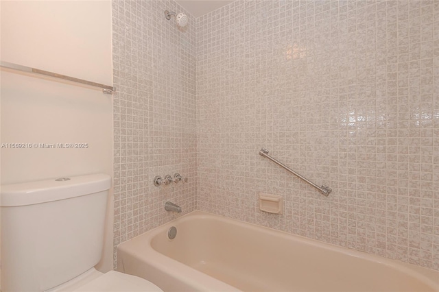 bathroom featuring toilet and bathtub / shower combination