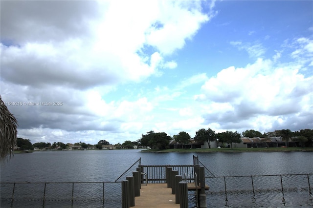 view of water feature with fence