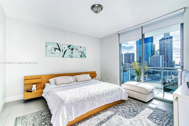 tiled bedroom with access to exterior and multiple windows