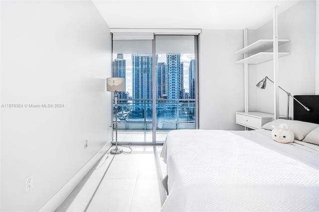 tiled bedroom with access to outside and expansive windows