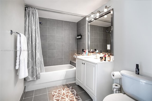 full bathroom featuring shower / bath combo with shower curtain, vanity, toilet, and tile flooring