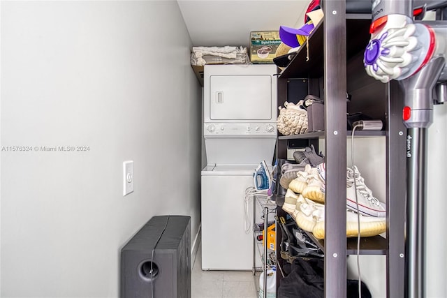 storage area featuring stacked washer / dryer