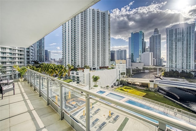 balcony featuring a swimming pool