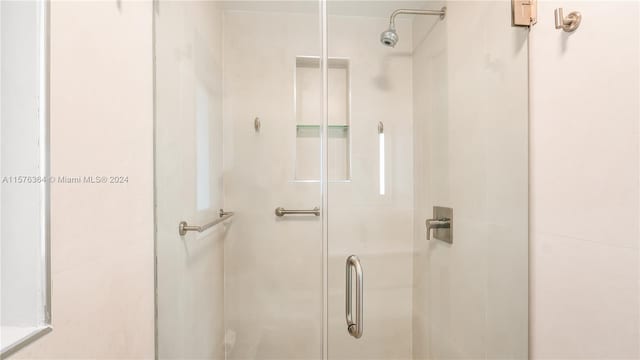 bathroom featuring an enclosed shower