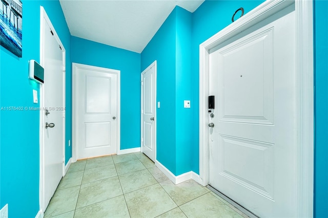 interior space featuring light tile floors