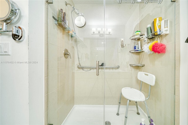 bathroom featuring tile walls and an enclosed shower