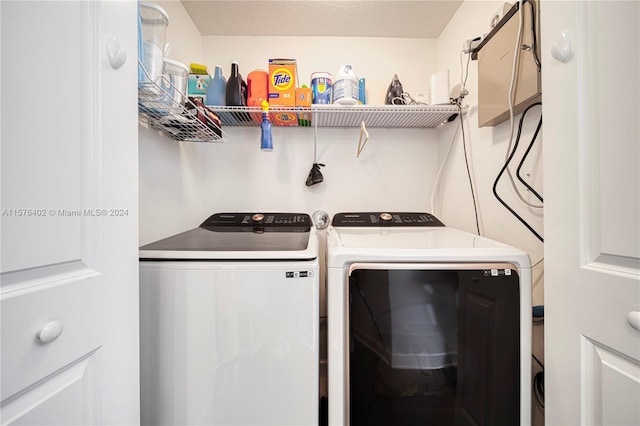 clothes washing area featuring independent washer and dryer