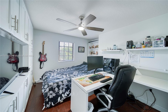 bedroom featuring a textured ceiling, ceiling fan, and dark wood-type flooring