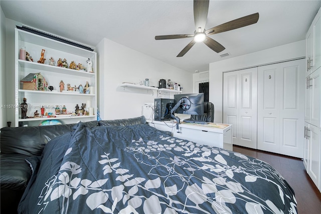 bedroom featuring a closet, dark hardwood / wood-style flooring, and ceiling fan