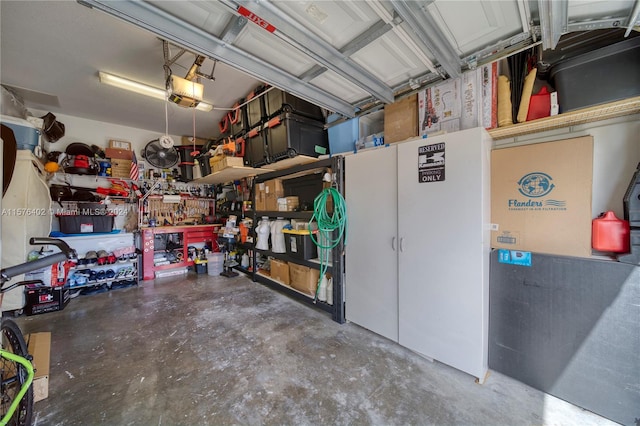 garage with a workshop area and a garage door opener