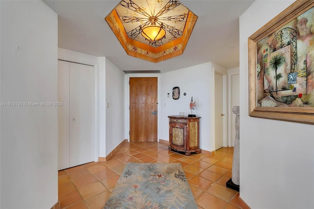 hall featuring light tile patterned flooring