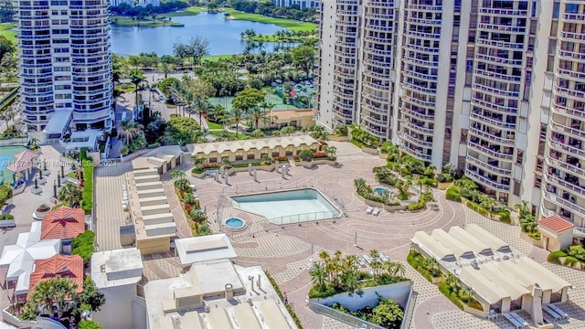 birds eye view of property with a water view