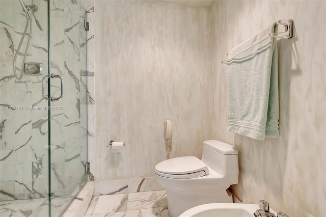 bathroom featuring toilet, an enclosed shower, and a bidet