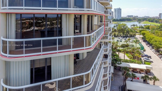 exterior space featuring a water view and a balcony