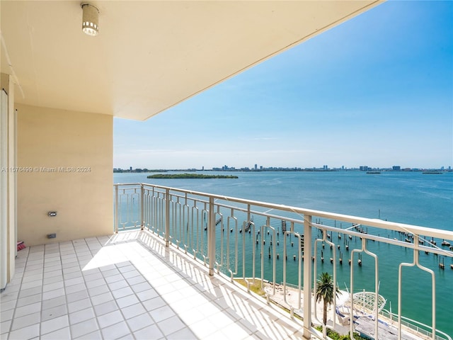 balcony featuring a water view