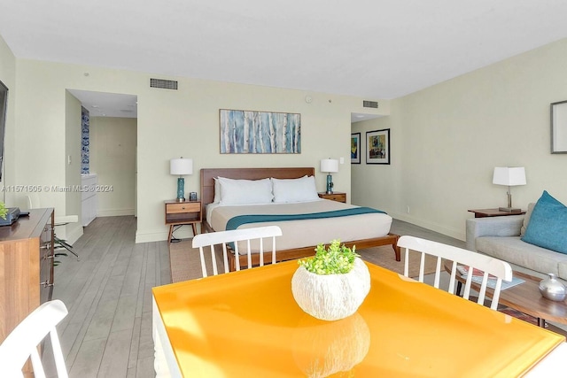 bedroom with hardwood / wood-style flooring